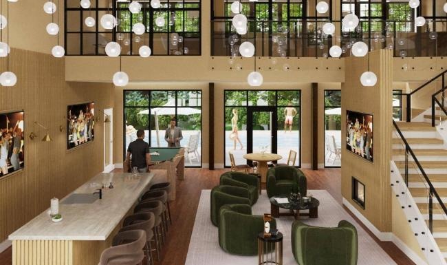 a clubroom with chairs, a bar, tv's and a fireplace