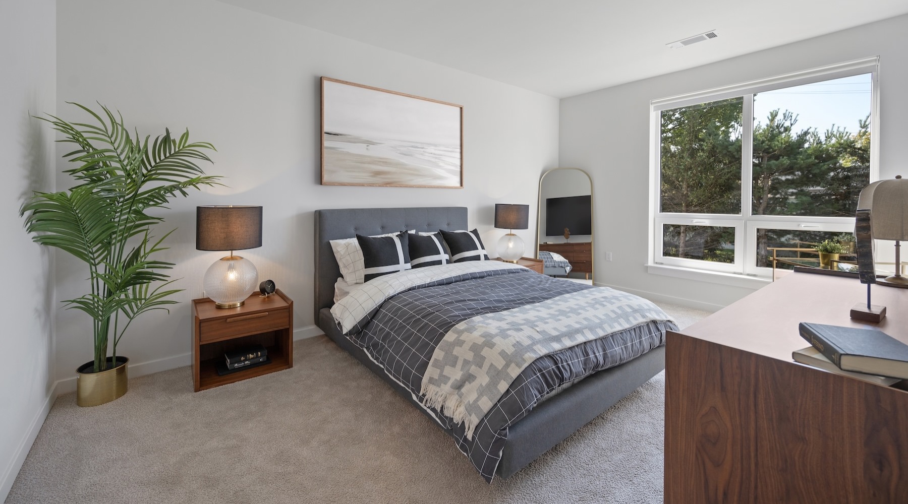 a bedroom with a bed and two nightstands