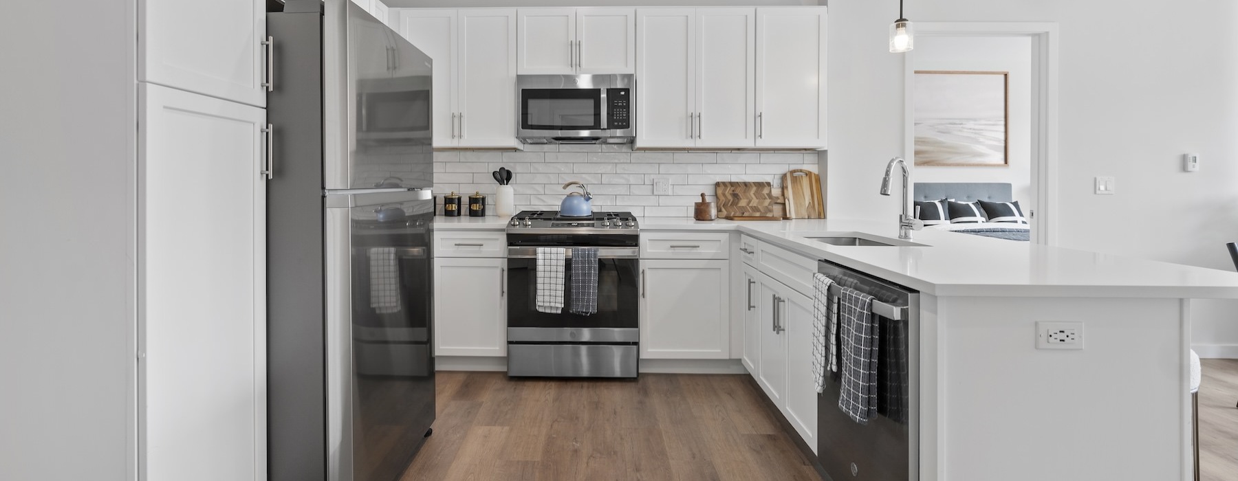 a kitchen with white cabinets