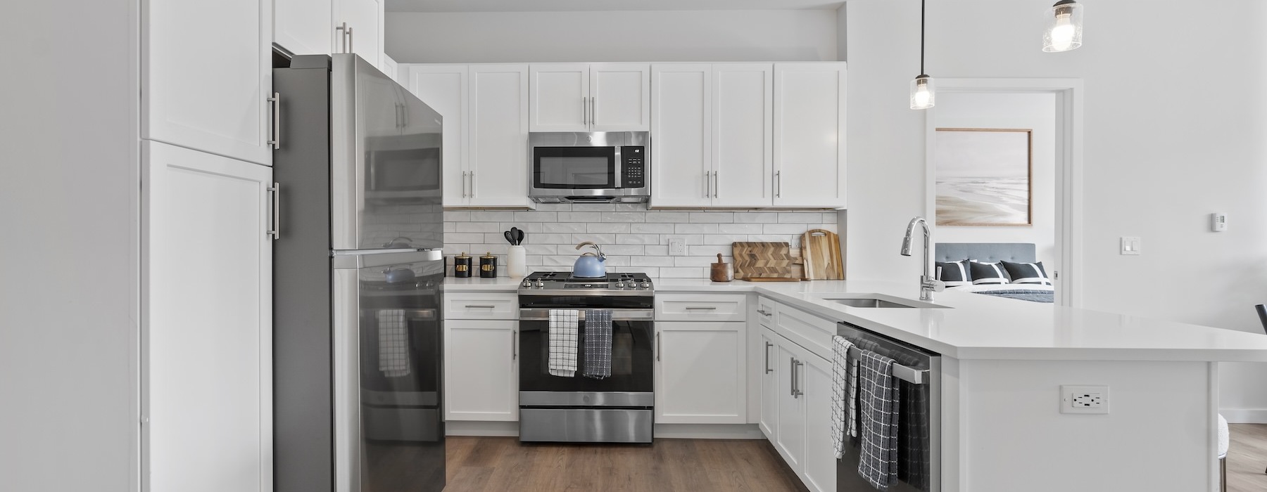 a kitchen with white cabinets