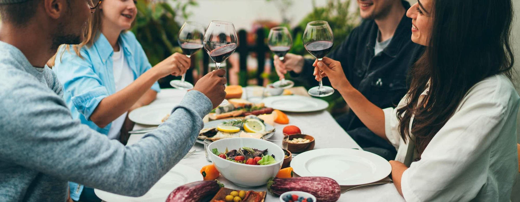 people at a table with food and drinks